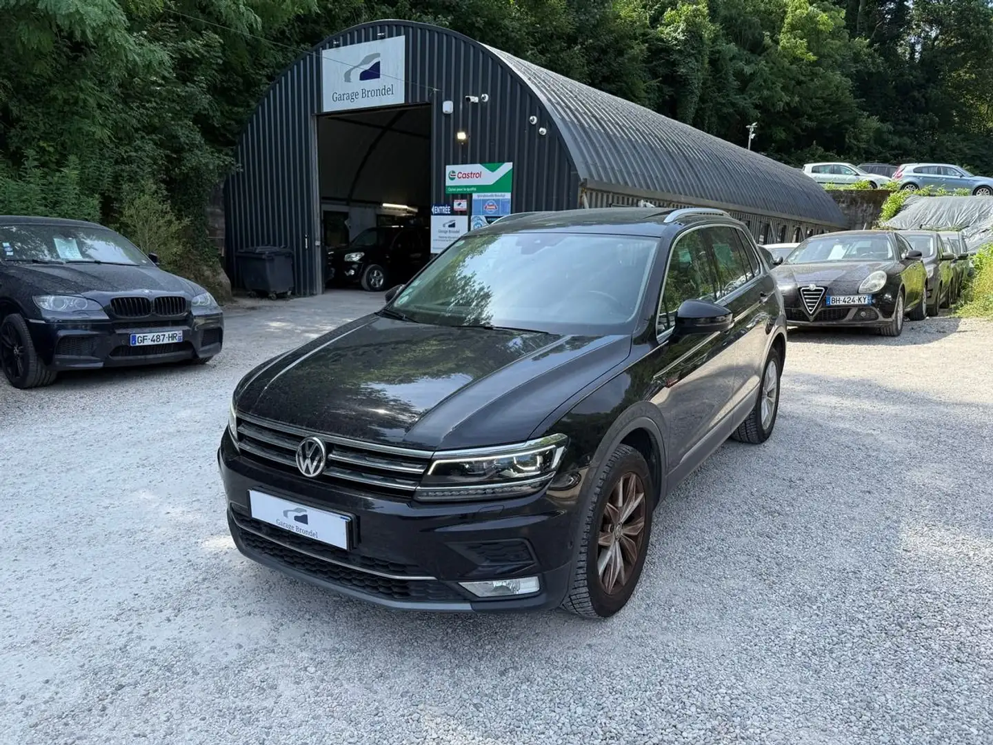 Volkswagen Tiguan 2.0 TDi 150cv 4Motion DSG7 Carat 2e main Noir - 1