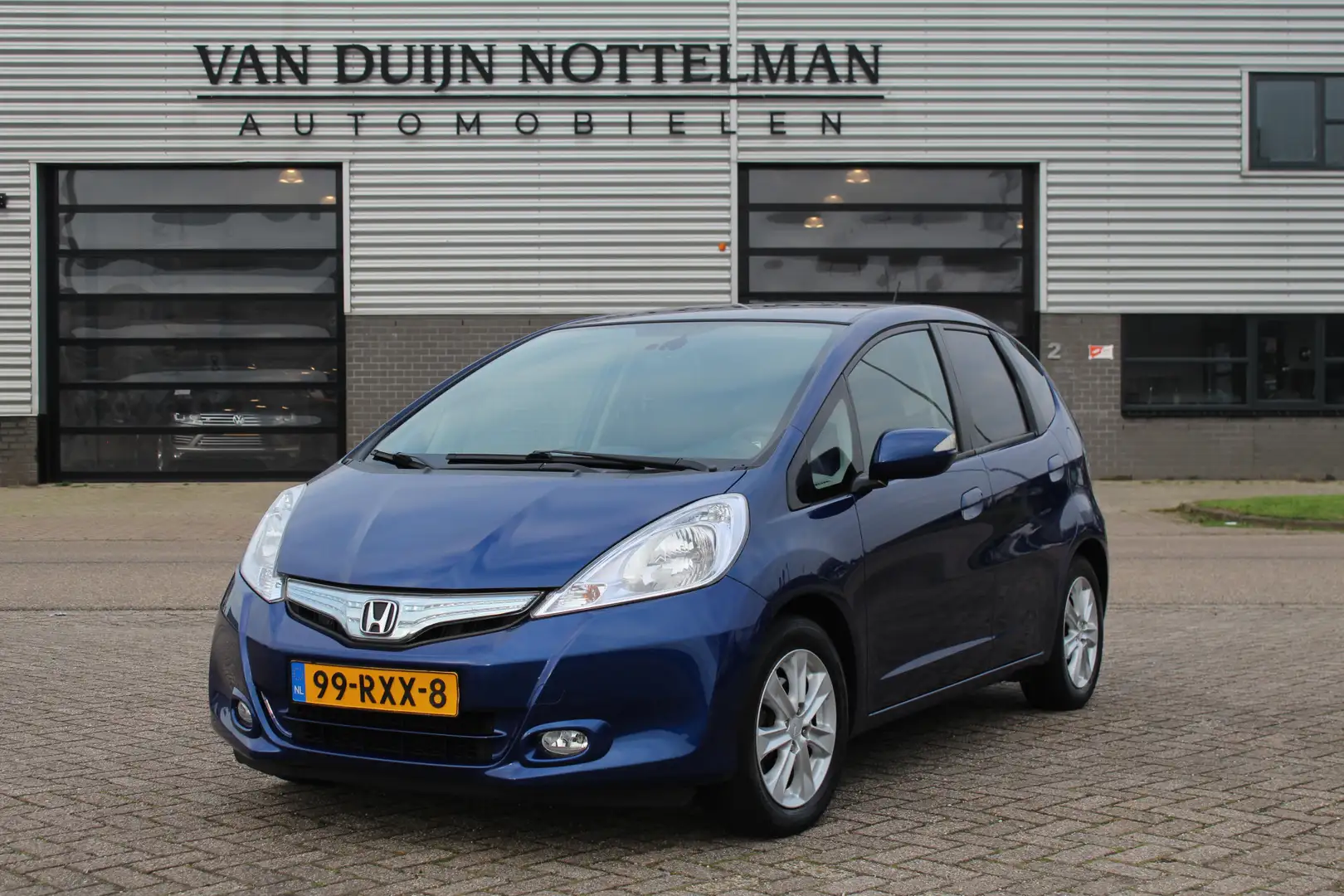 Honda Jazz 1.4 Hybrid Business Mode + / Navigatie / Climate / Blauw - 1