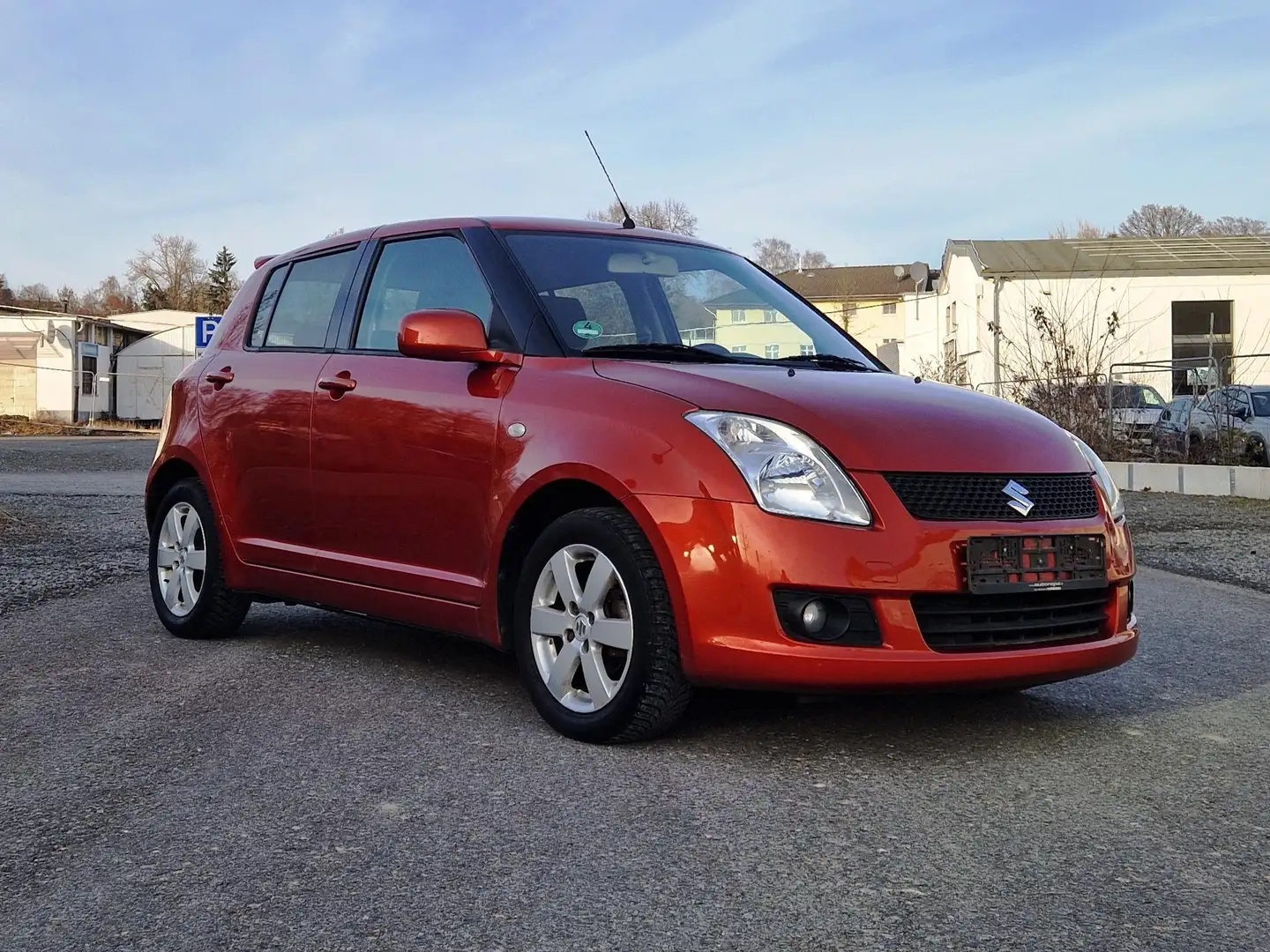 Suzuki Swift Snow (5-trg.)/2Hand/Klima/Allwetterreifen/5Türe Orange - 1
