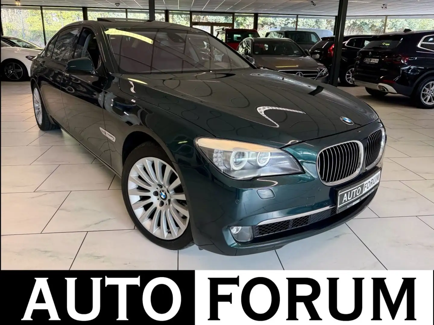 BMW 750 Li xDrive LANG SHADOW 360CAM HEADUP SOFT ACC Groen - 1