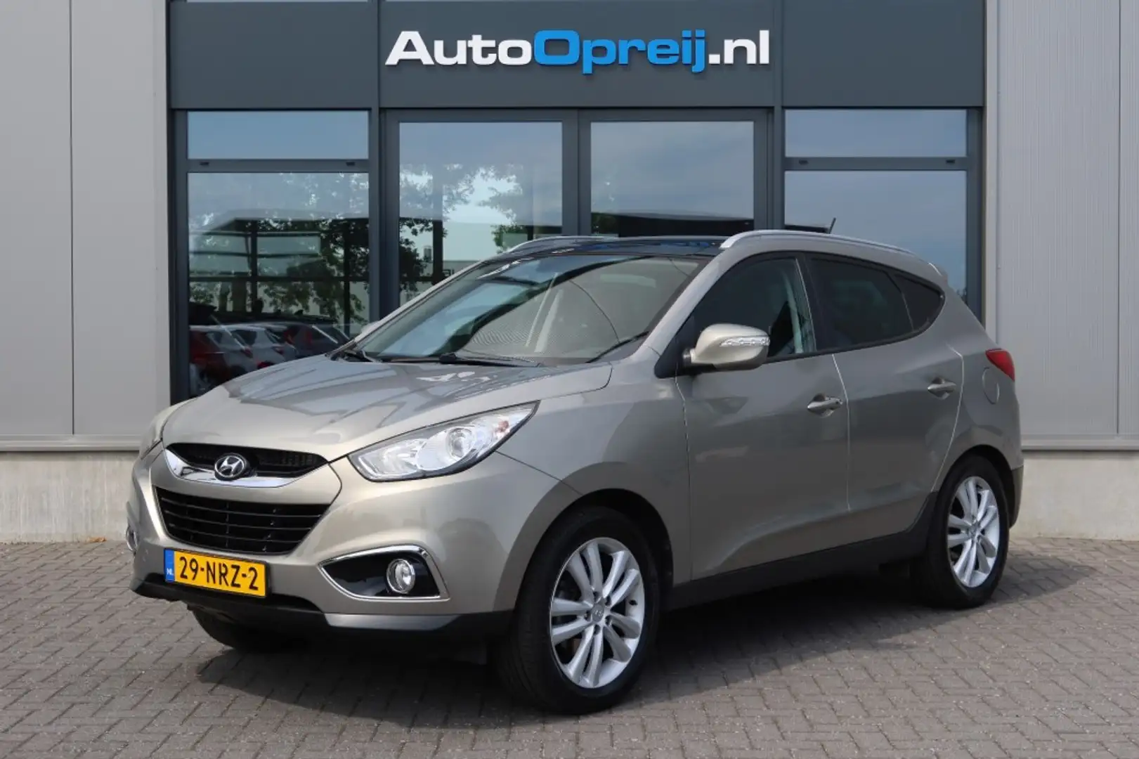 Hyundai iX35 2.0i i-Catcher NAVI, Camera, Schuif/kanteldak, Tre Grijs - 1
