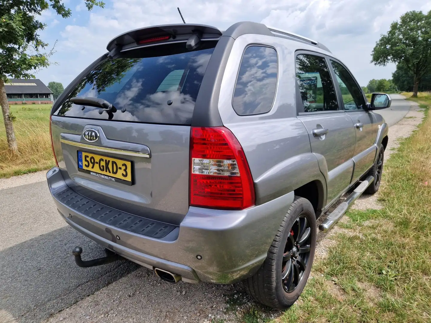 Kia Sportage 2.0 CVVT X-cite side bars trekhaak lederen bekl. Gri - 2