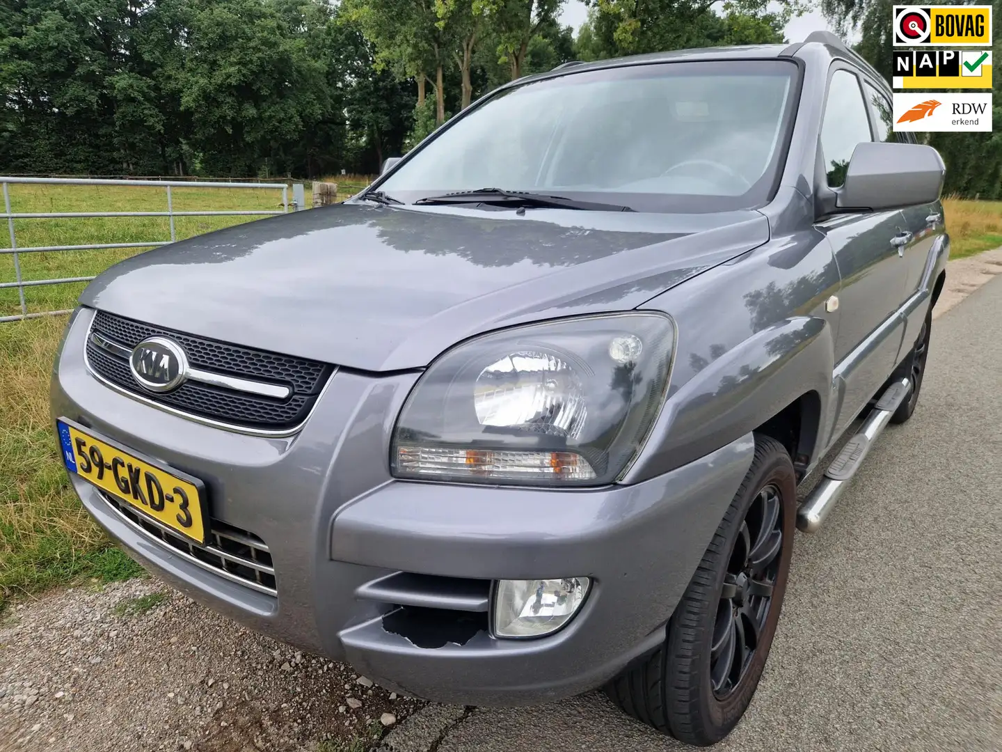 Kia Sportage 2.0 CVVT X-cite side bars trekhaak lederen bekl. Gri - 1