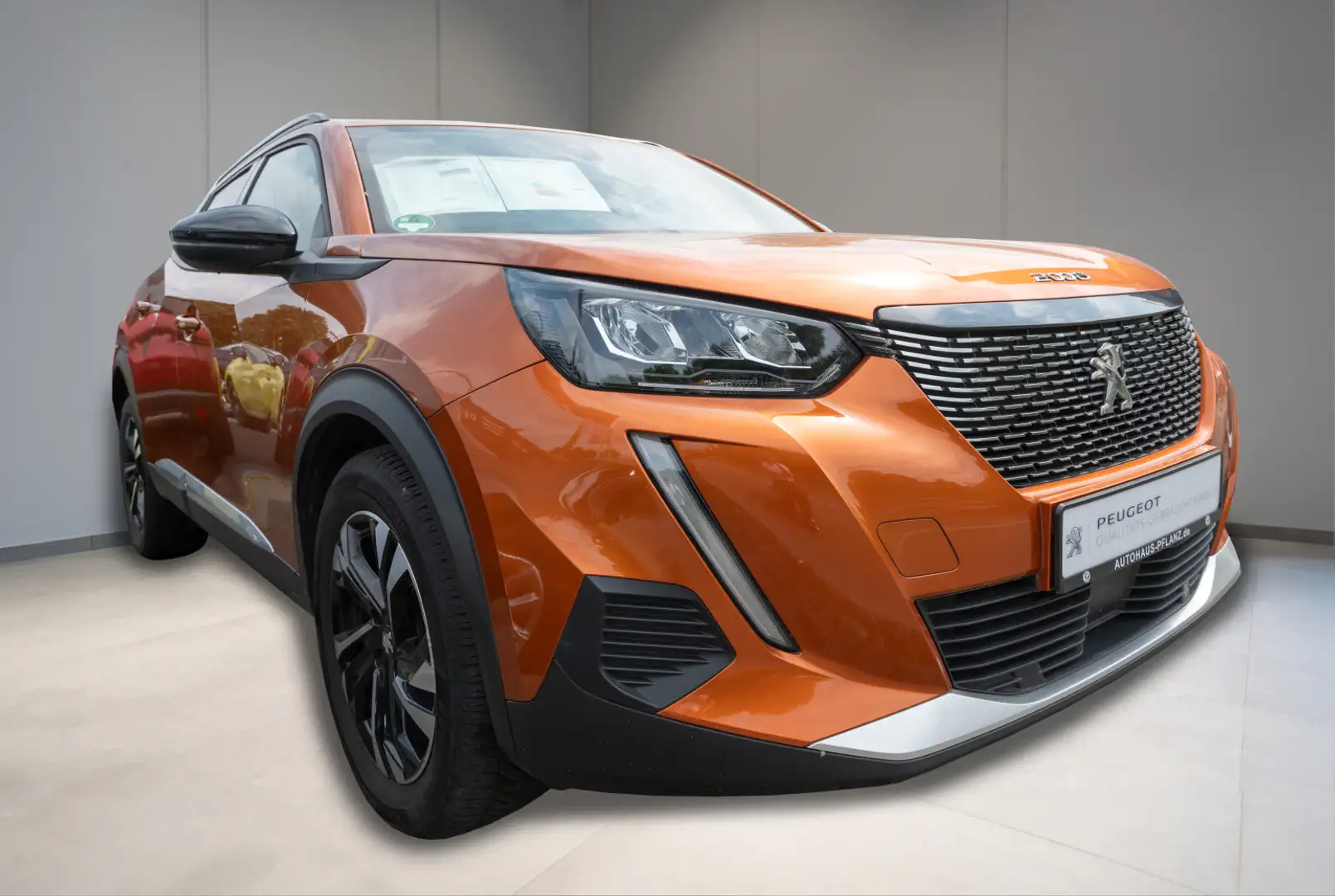 Peugeot 2008 Allure 1.2 PureTech 100 Oranje - 2