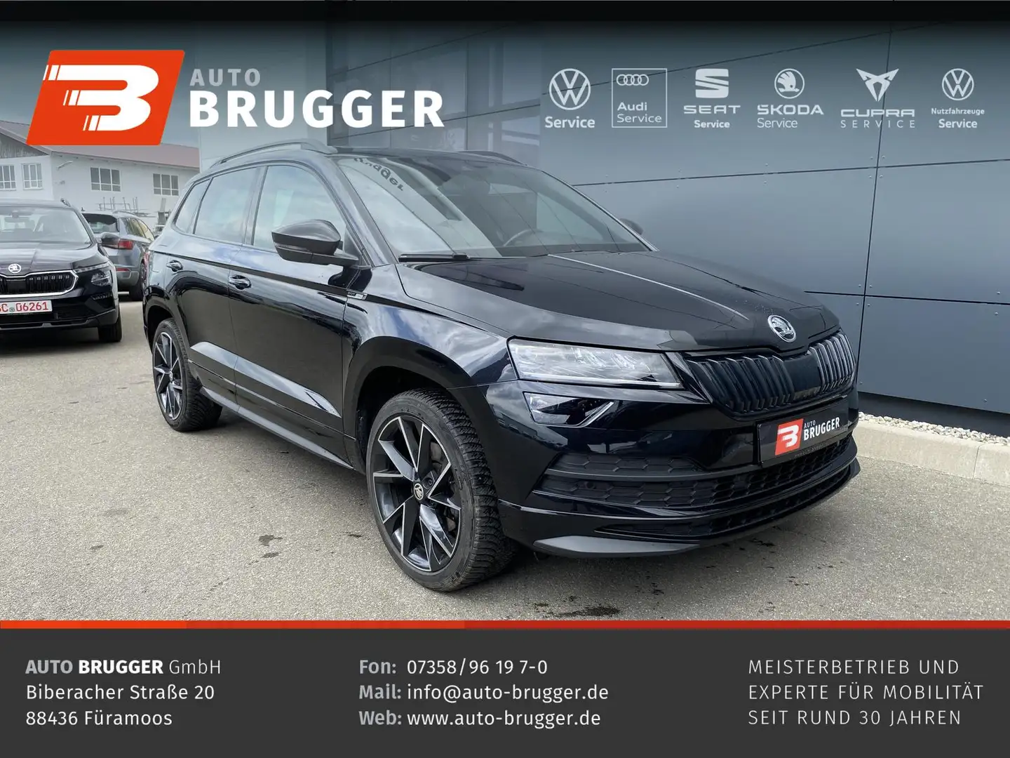 Skoda Karoq 2.0 TSI DSG Sportline 4x4 AHK NAVI PANO Zwart - 1