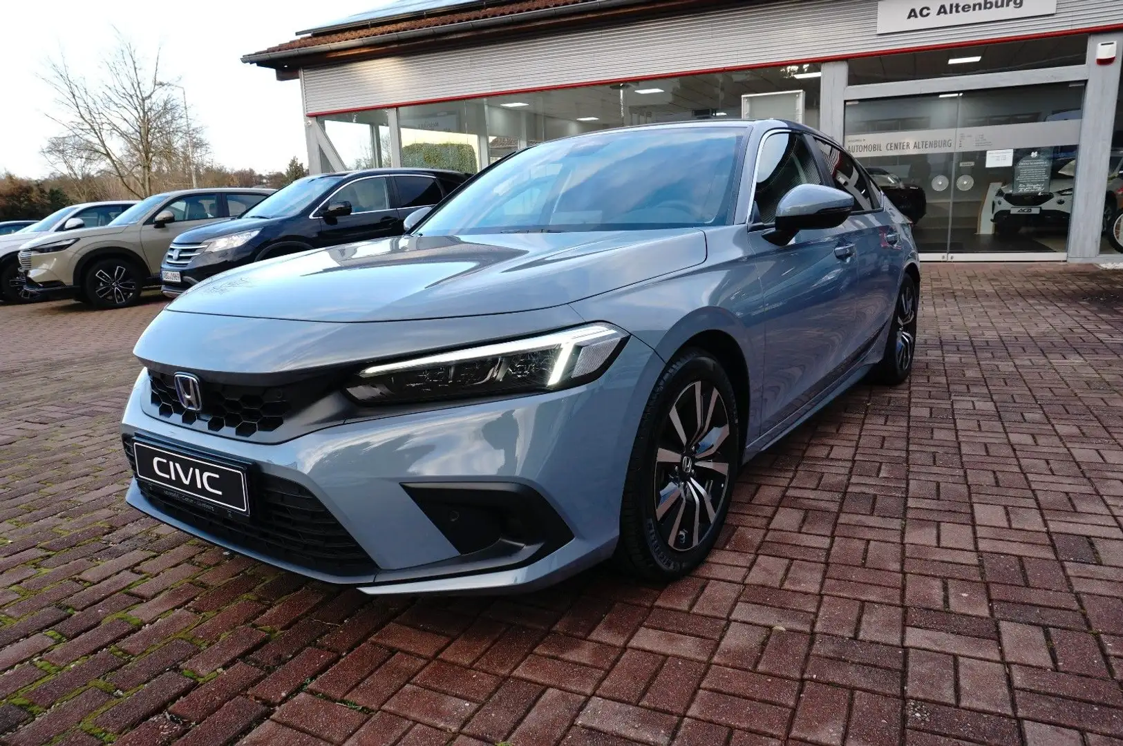 Honda Civic 2.0  Hybrid e:HEV Elegance Šedá - 1
