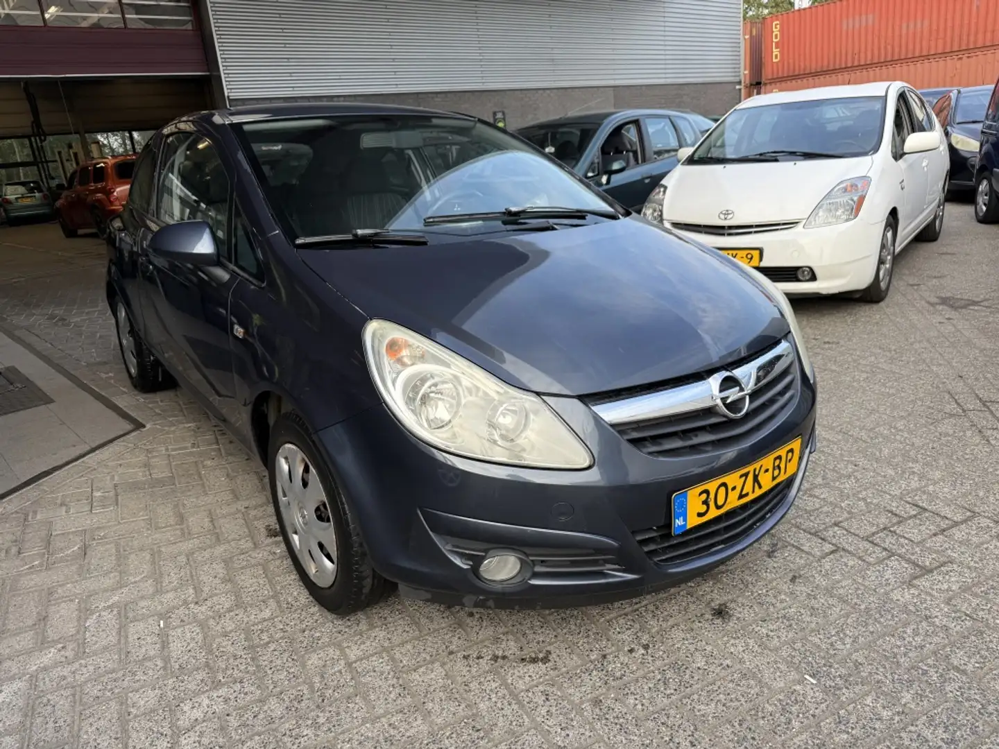 Opel Corsa 1.2-16V Enjoy Grijs - 1