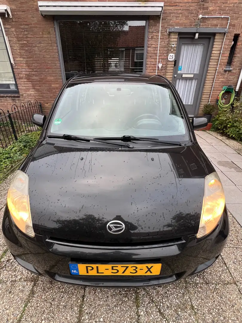 Daihatsu Sirion Sirion 1.0-12V Trend Zwart - 1