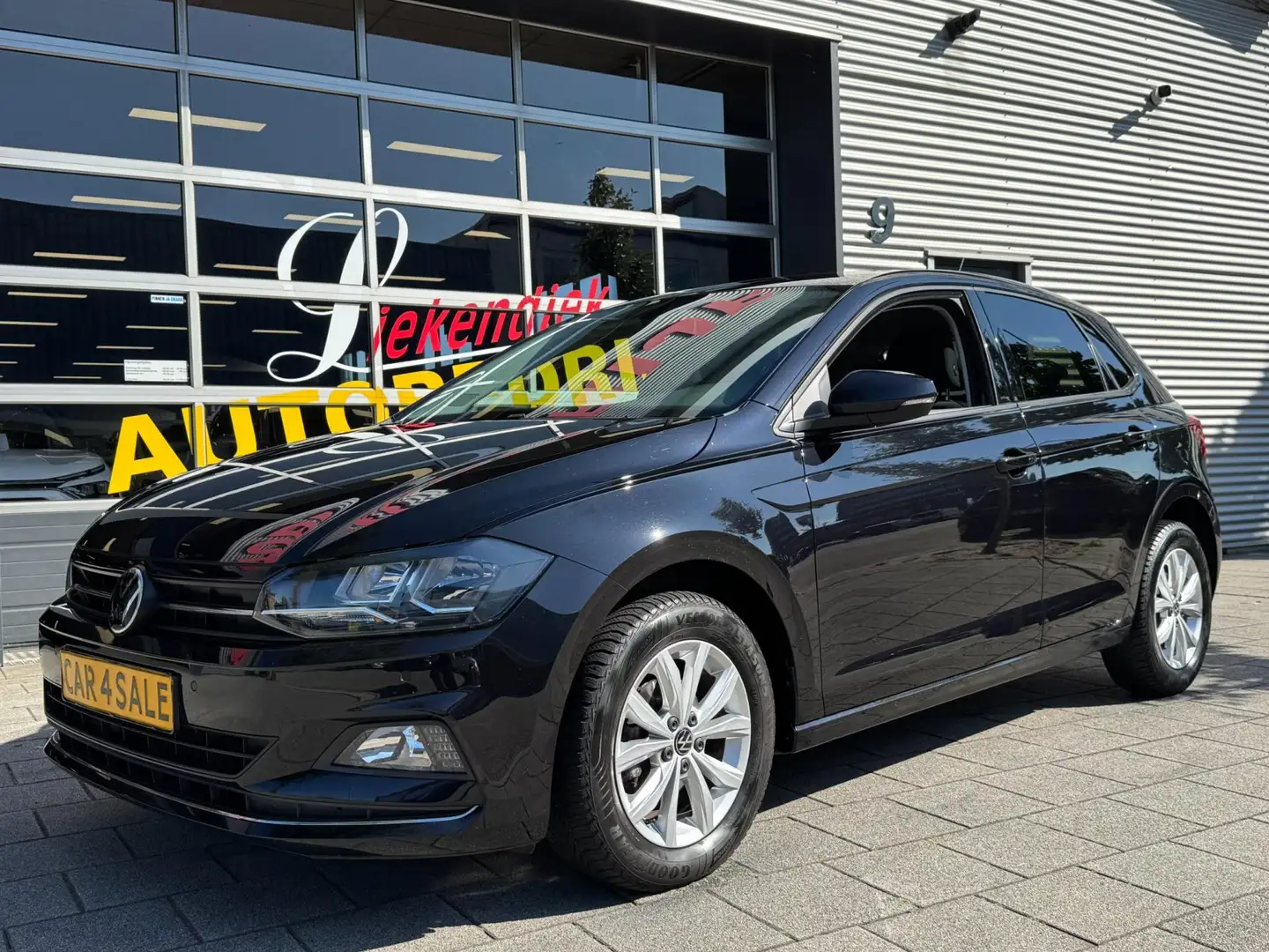Volkswagen Polo 1.0 TSI Highline - Navigatie I Airco i Sport velge Zwart - 1