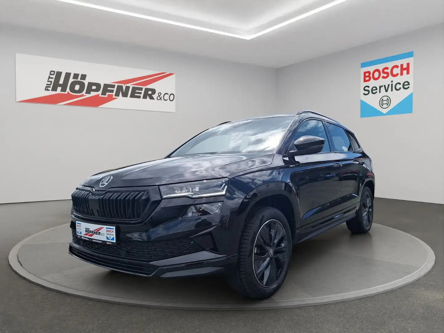 Skoda Karoq Sportline 2.0 TSI 4x4 DSG / AHK / Navi / Schwarz - 1