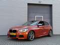 BMW 135 1-serie M135i xDrive High Executive I Aut. I 320PK Orange - thumbnail 1