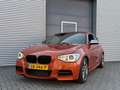 BMW 135 1-serie M135i xDrive High Executive I Aut. I 320PK Orange - thumbnail 2