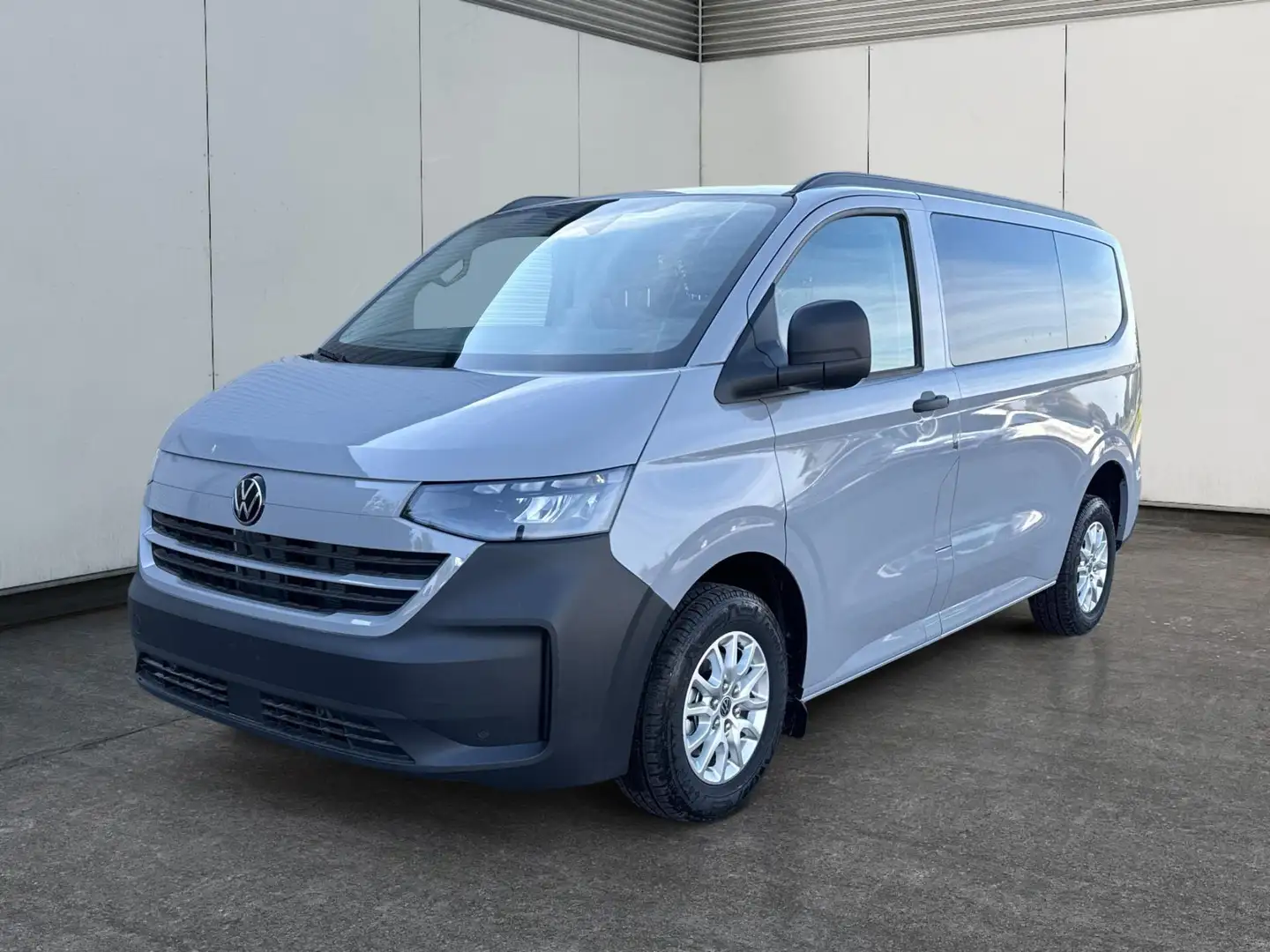 Volkswagen T7 Caravelle Basis KR+SHZ+9-Sitzer+AHK+GJR+KLIMAAUT.+KAMERA+... Grau - 1