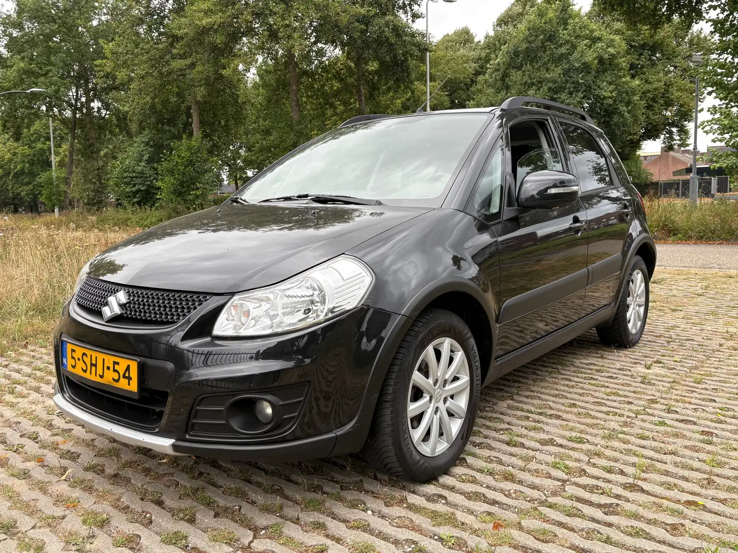 Suzuki SX4 1.6 Executive / airco / stoelverwarming / nette au Noir - 1