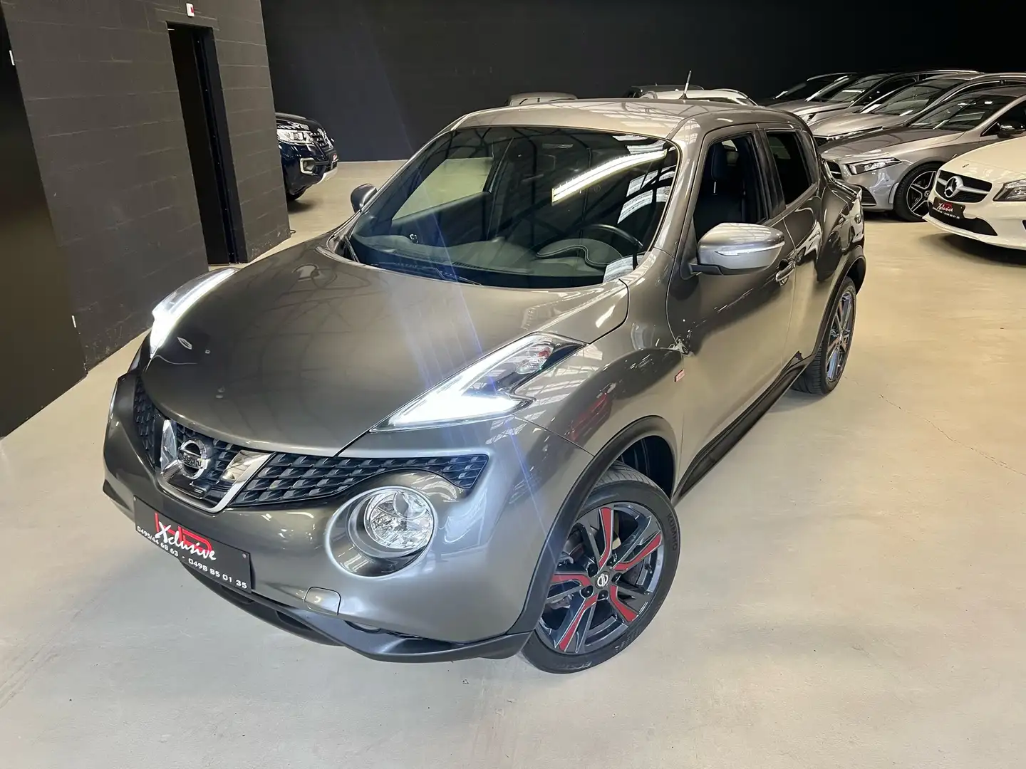 Nissan Juke 1.2 DIG-T 2WD Tekna GPS*CAMERA*JA*LED*GARANTIE* Grijs - 1