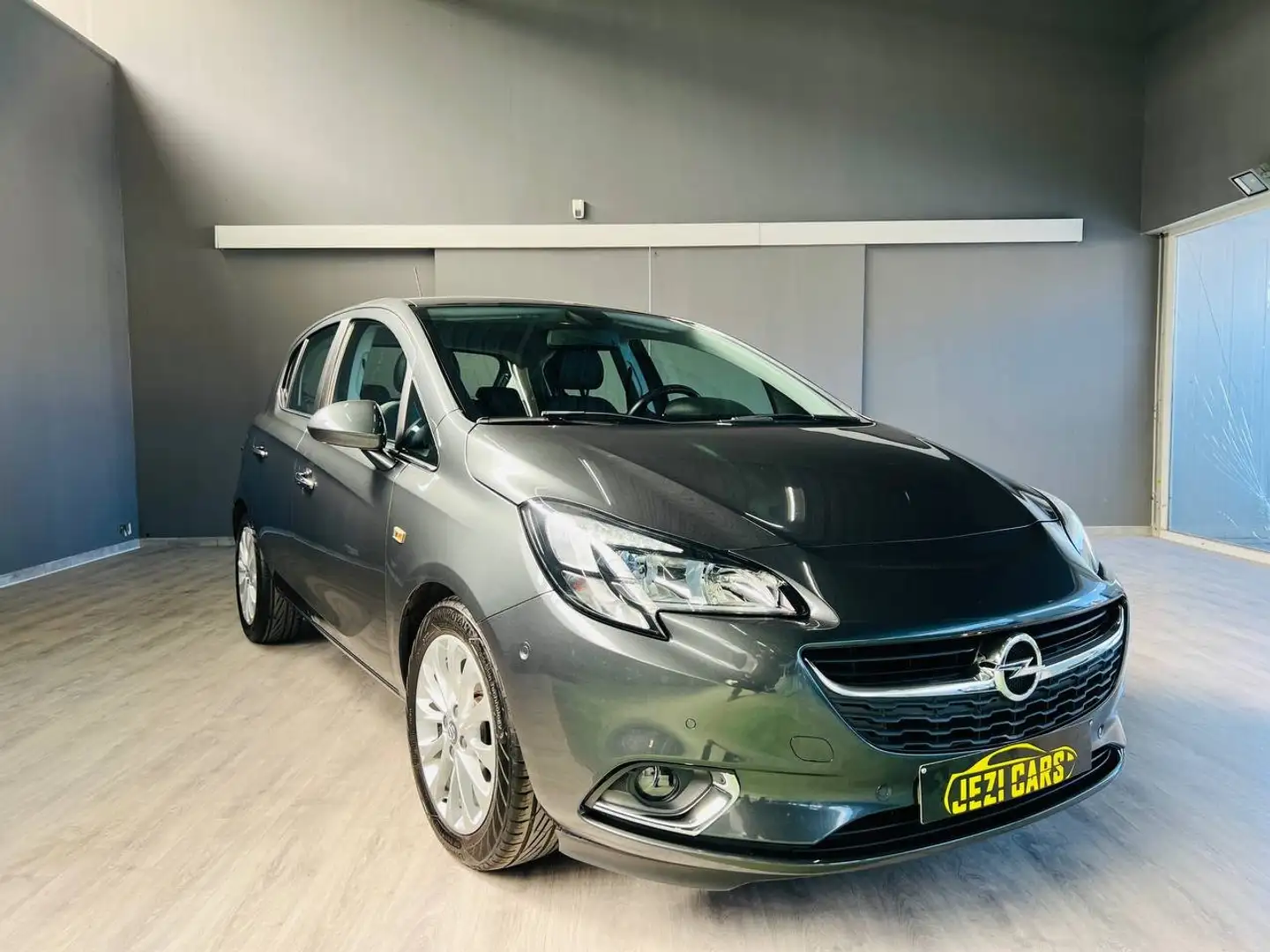 Opel Corsa 1.4i|Automaat|1jaar garantie|Sensoren|Navi|Benzine Gris - 1