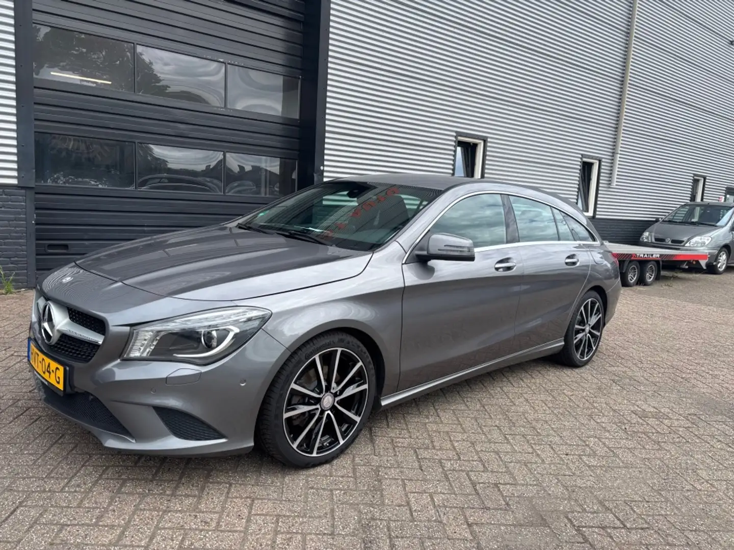 Mercedes-Benz CLA 180 Shooting Brake Lease Edit. Amb. 3 MND GAR | NAVI | Grijs - 1