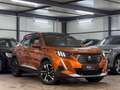 Peugeot 2008 HYBRID 136 e-DSC6 Allure*PANO*KAM*LEDER*UVM Orange - thumbnail 1
