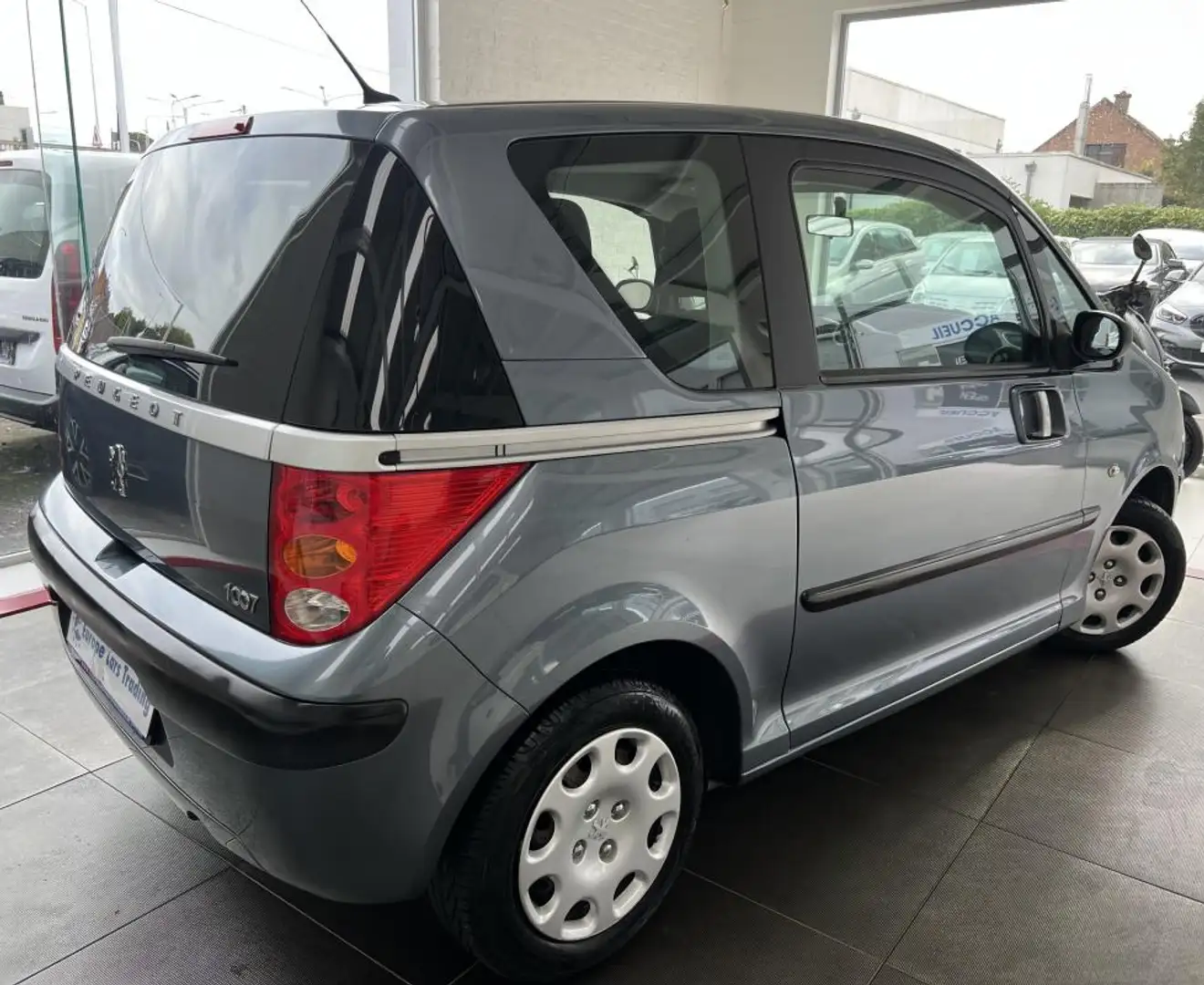 Peugeot 1007 TRENDY 1.4i 74 CH 1ÈRE MAIN CLIM GAR 12M Grijs - 2