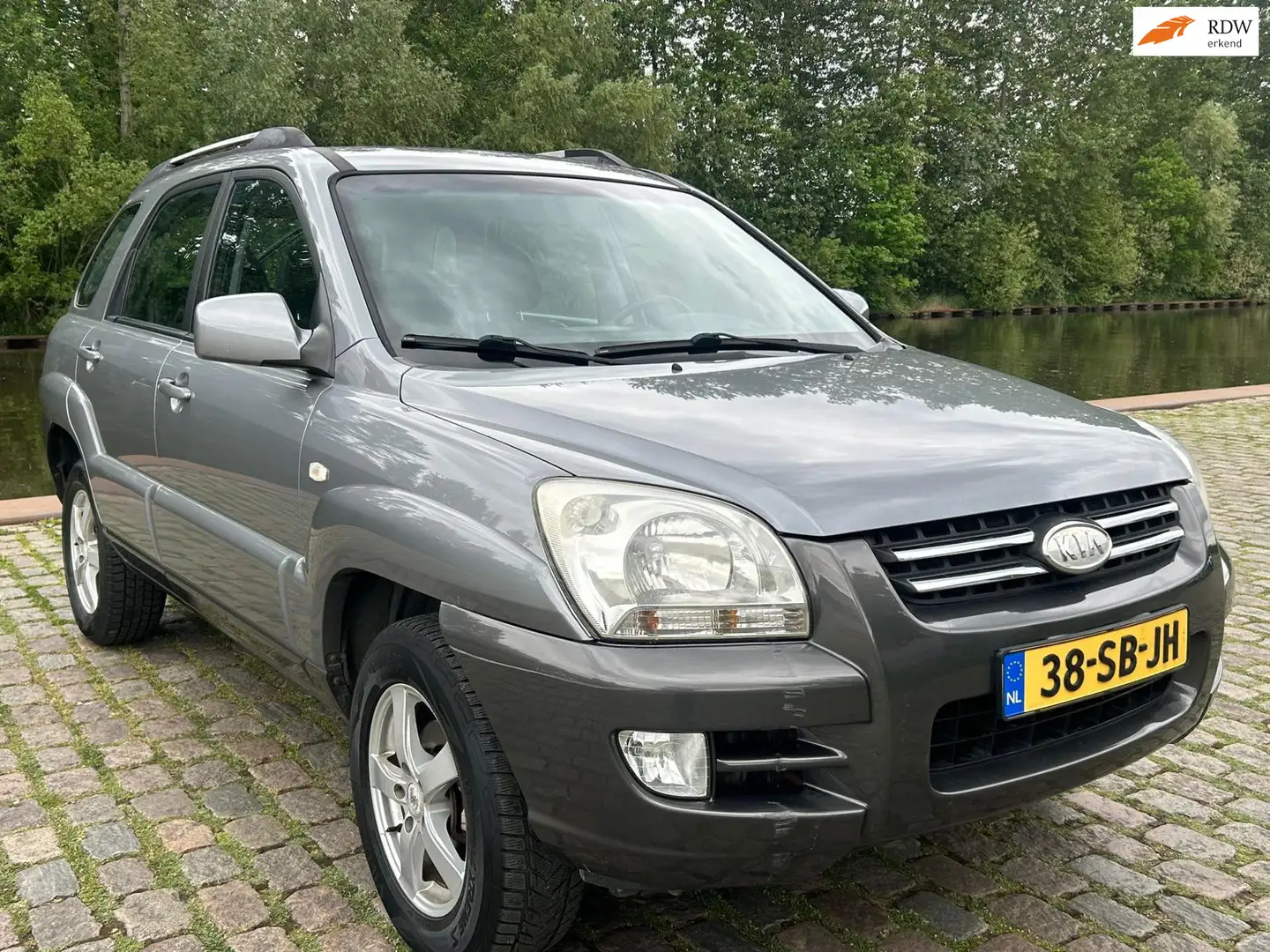Kia Sportage 2.0 CVVT Executive airco elektrische ramen cv op a Gri - 1