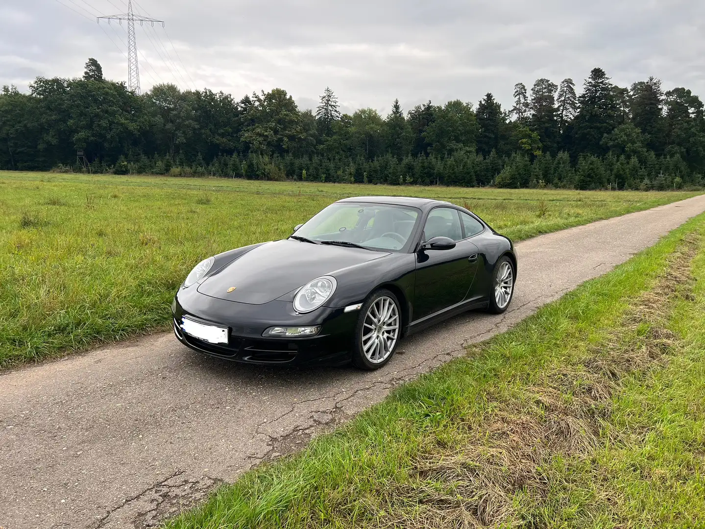 Porsche 997 Carrera 4 Coupe Schwarz - 1