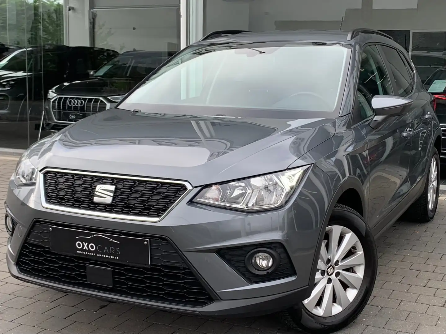 SEAT Arona 1.0 TSI / Gps / Clim Auto / CarPlay / Cruise / PDC Grijs - 1