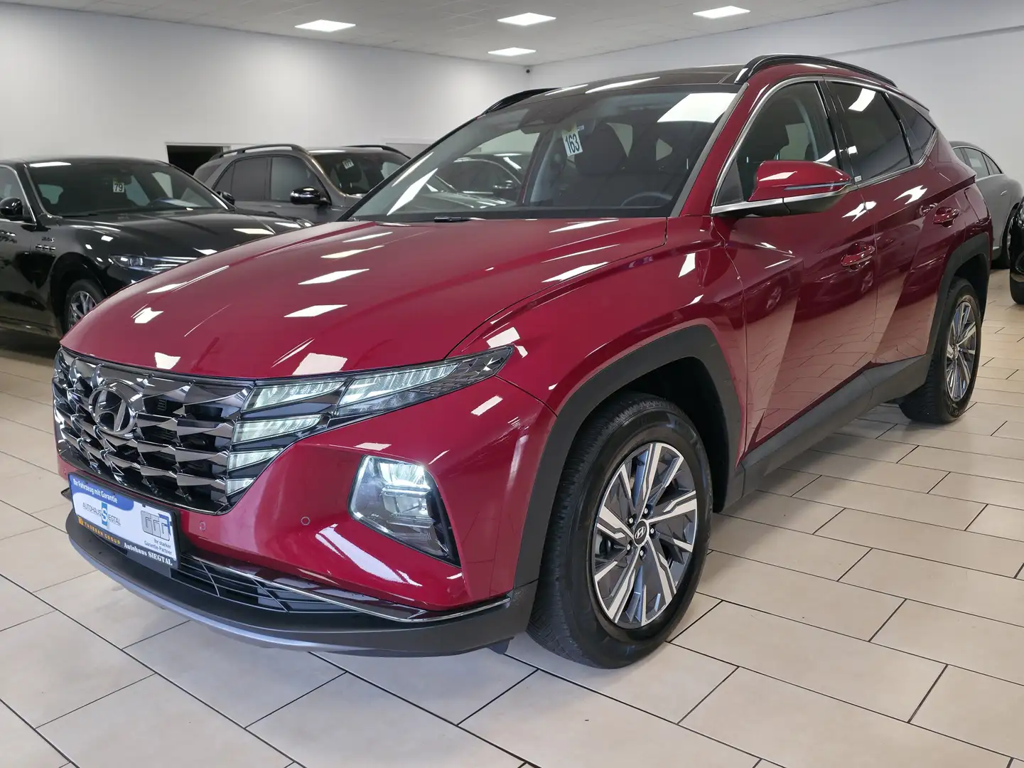 Hyundai TUCSON Hybrid*Pano*Navi*R-Cam*CarPlay*SHZ*LED*1H Rot - 1