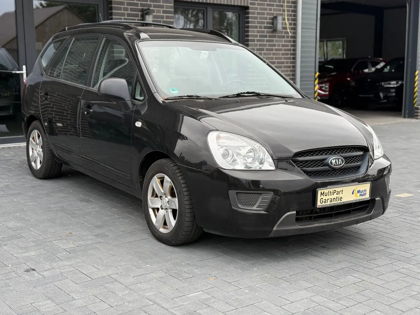 Kia Carens 2.0 LX*Automatik*Klima*ZV*Elek F+S*Alu*2H Schwarz - 1