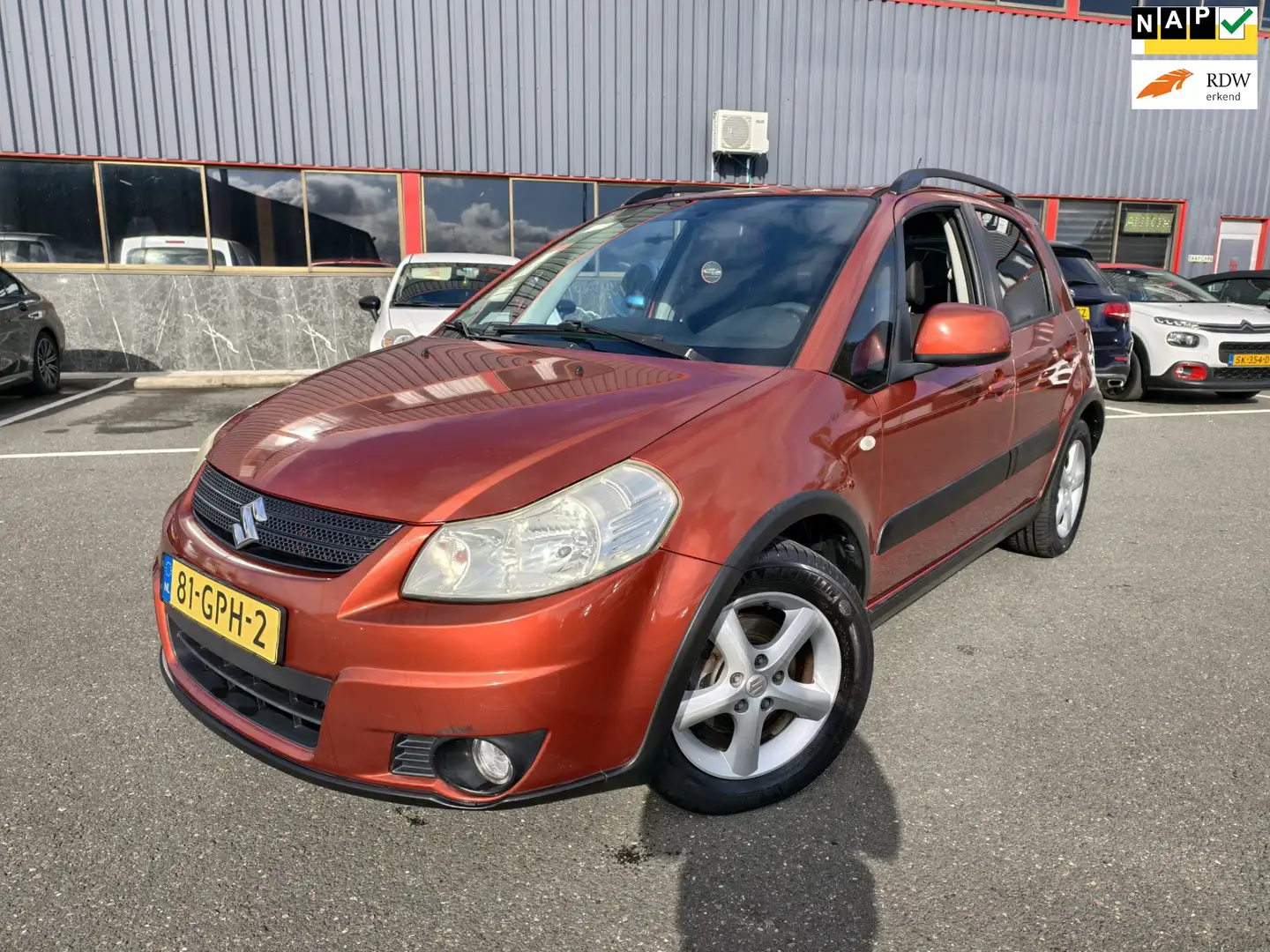 Suzuki SX4 1.6 Shogun // AIRCO / NAP / CRUISE / ACC / TREKHAA Oranje - 1