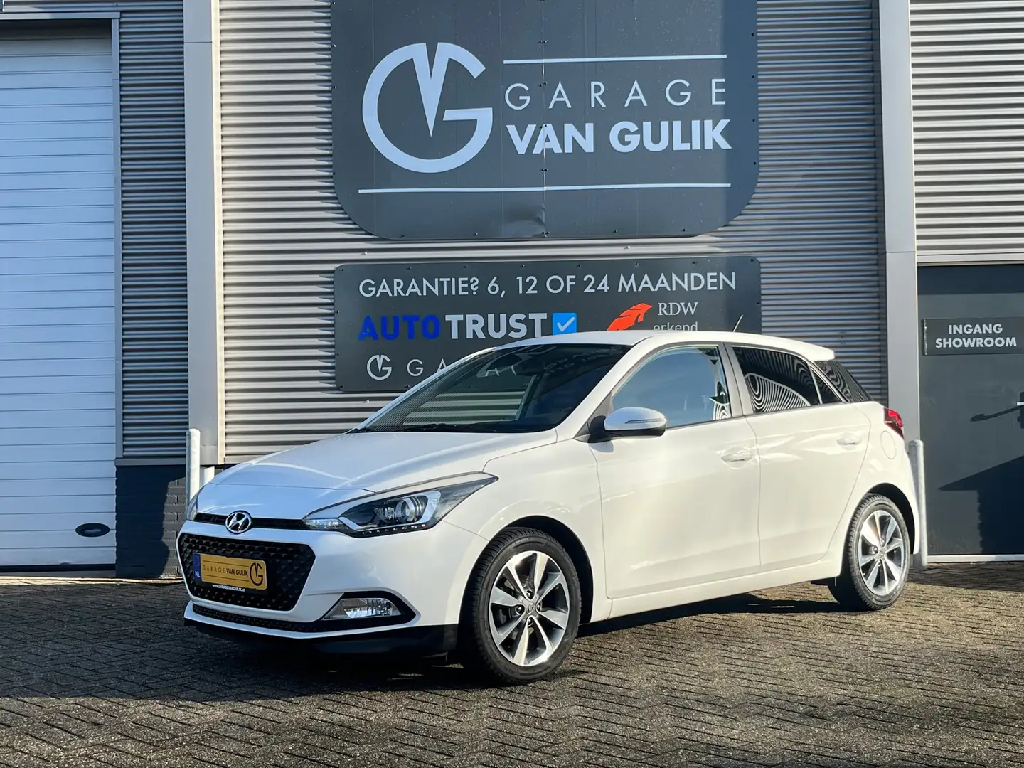Hyundai i20 1.2 84PK HP Clima,Cruise,Stoel&StuurVerw.,Usb/Aux, Wit - 1