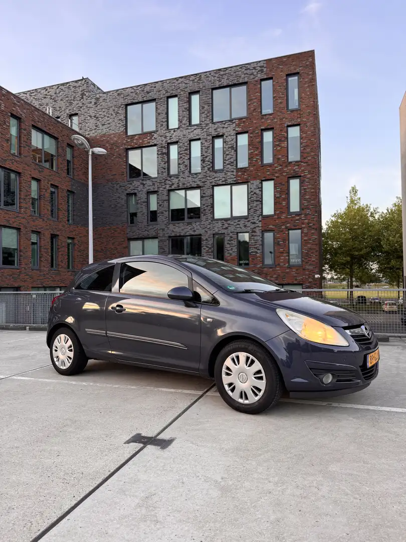 Opel Corsa 1.2-16V Enjoy Grijs - 1