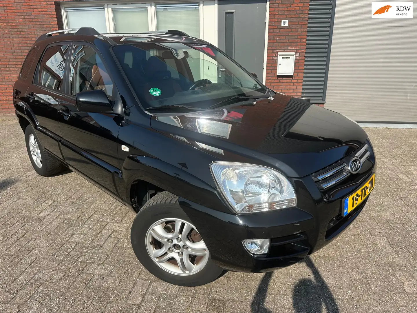 Kia Sportage 2.0 CVVT M-bition / Navi / Leder / PDC / Cruise / Schwarz - 1