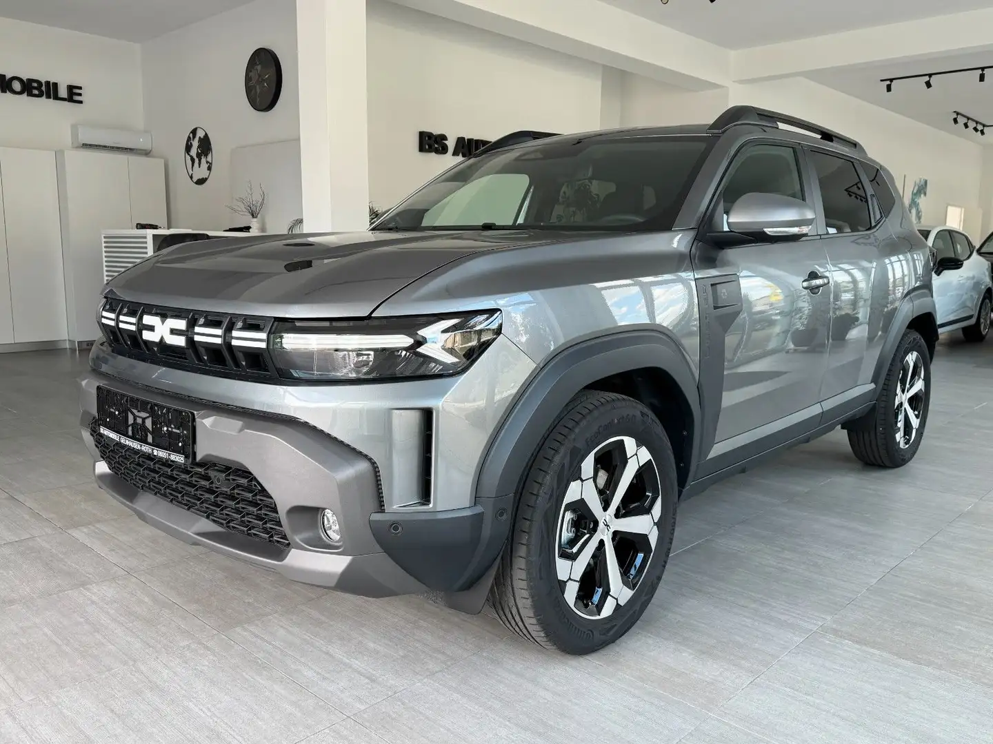 Dacia Duster HYBRID Jorney 140 Aut Grijs - 1