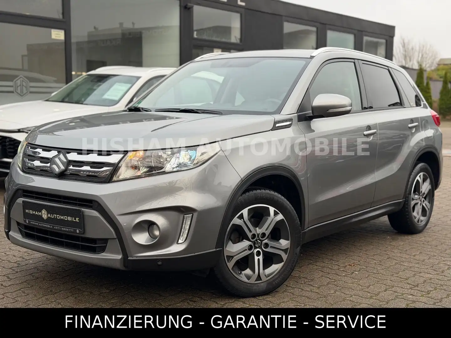 Suzuki Vitara 1.6 COMFORT+ 4X4/AUTOM/PANO/CAM/NAVI/PDC Grau - 1