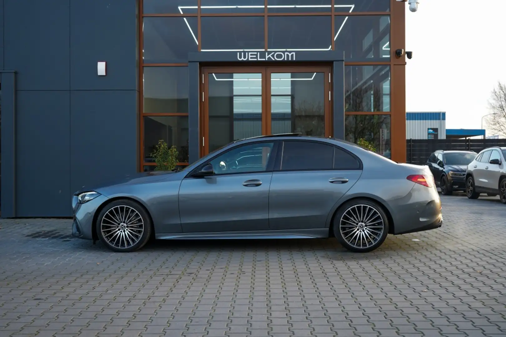 Mercedes-Benz C 180 AMG Line | Pano | Sfeer | Led | Cruise | Trekhaak Grijs - 2