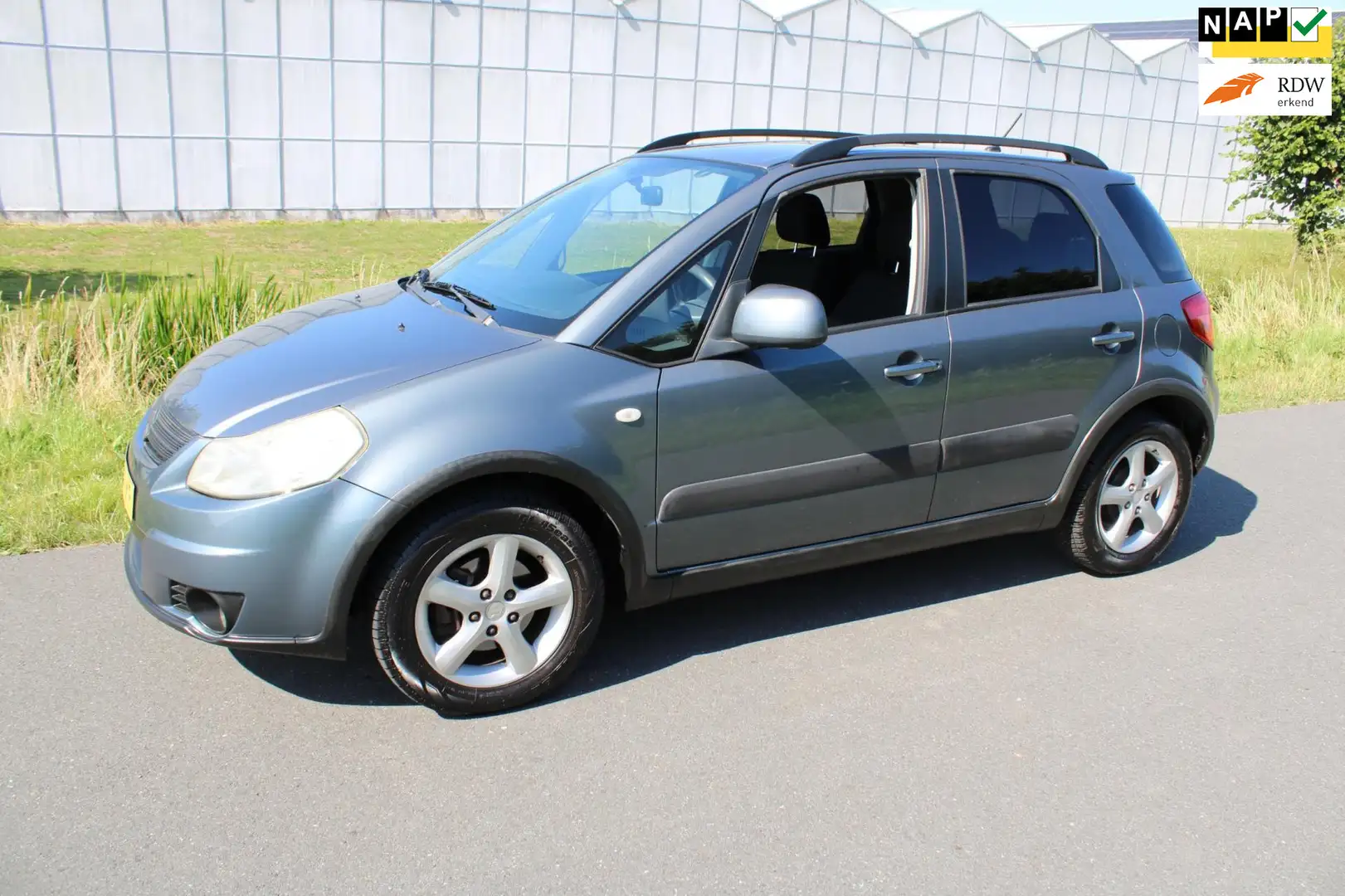 Suzuki SX4 1.6 Shogun met Airco Grijs - 1