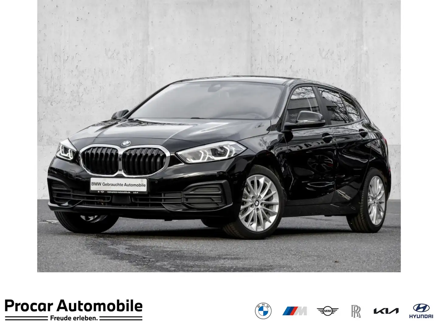 BMW 118 i LC PROF+DA+AHK+RFK+SHZ+FERNLICHT ASS+NAVI+LED+DA Schwarz - 1
