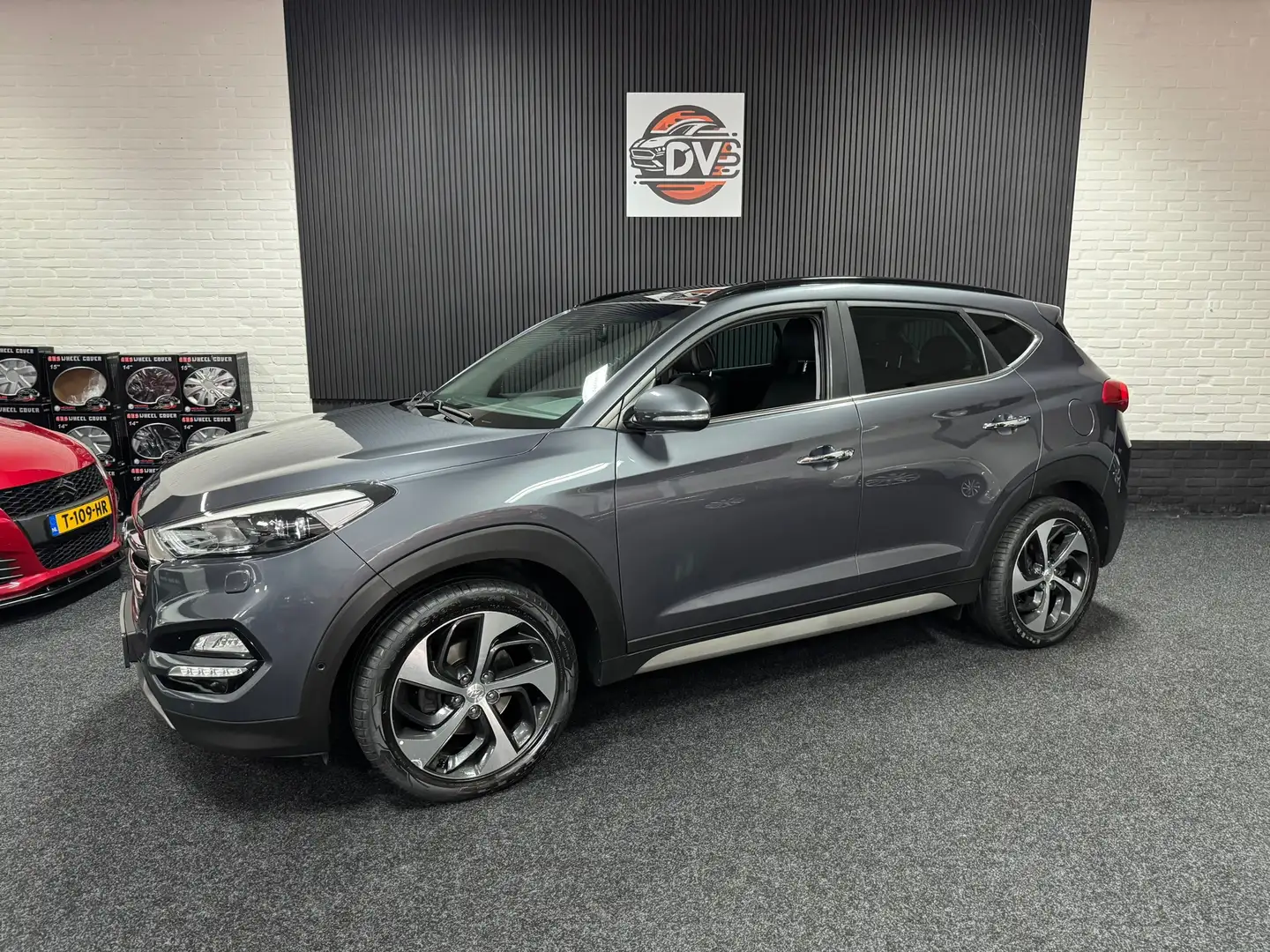 Hyundai TUCSON 1.6 T-GDi Premium 4WD, LED, PANO DAK, CRUISE, STL Grau - 1