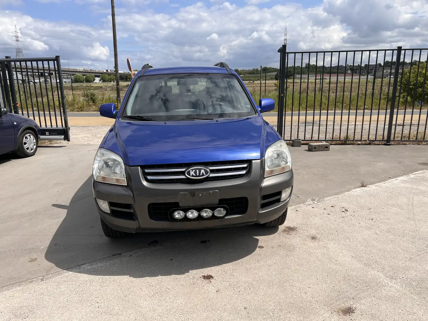 Kia Sportage 2.0i DOHC Deluxe Blauw - 1