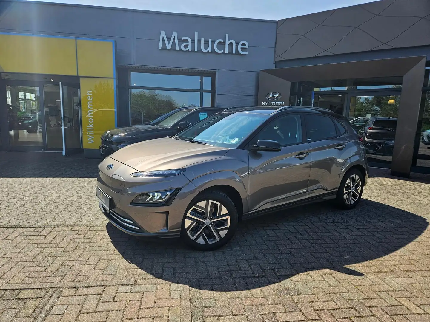 Hyundai KONA Elektro (150kW) TREND-Paket+Navi+Assistenz+Dachlac Bronze - 1