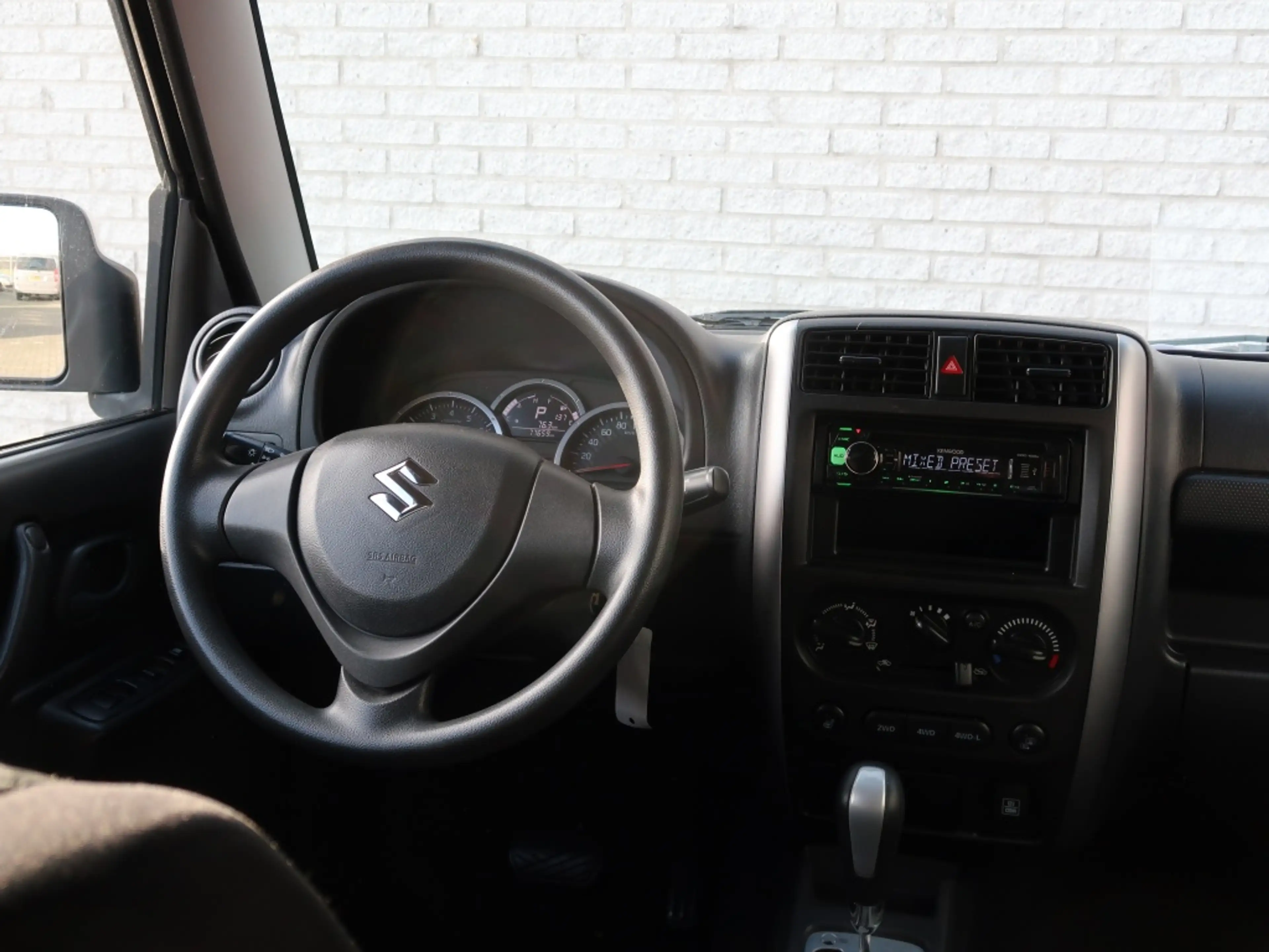 Suzuki Jimny 1.3 Exclusive / Automaat / 4x4 — photo 8