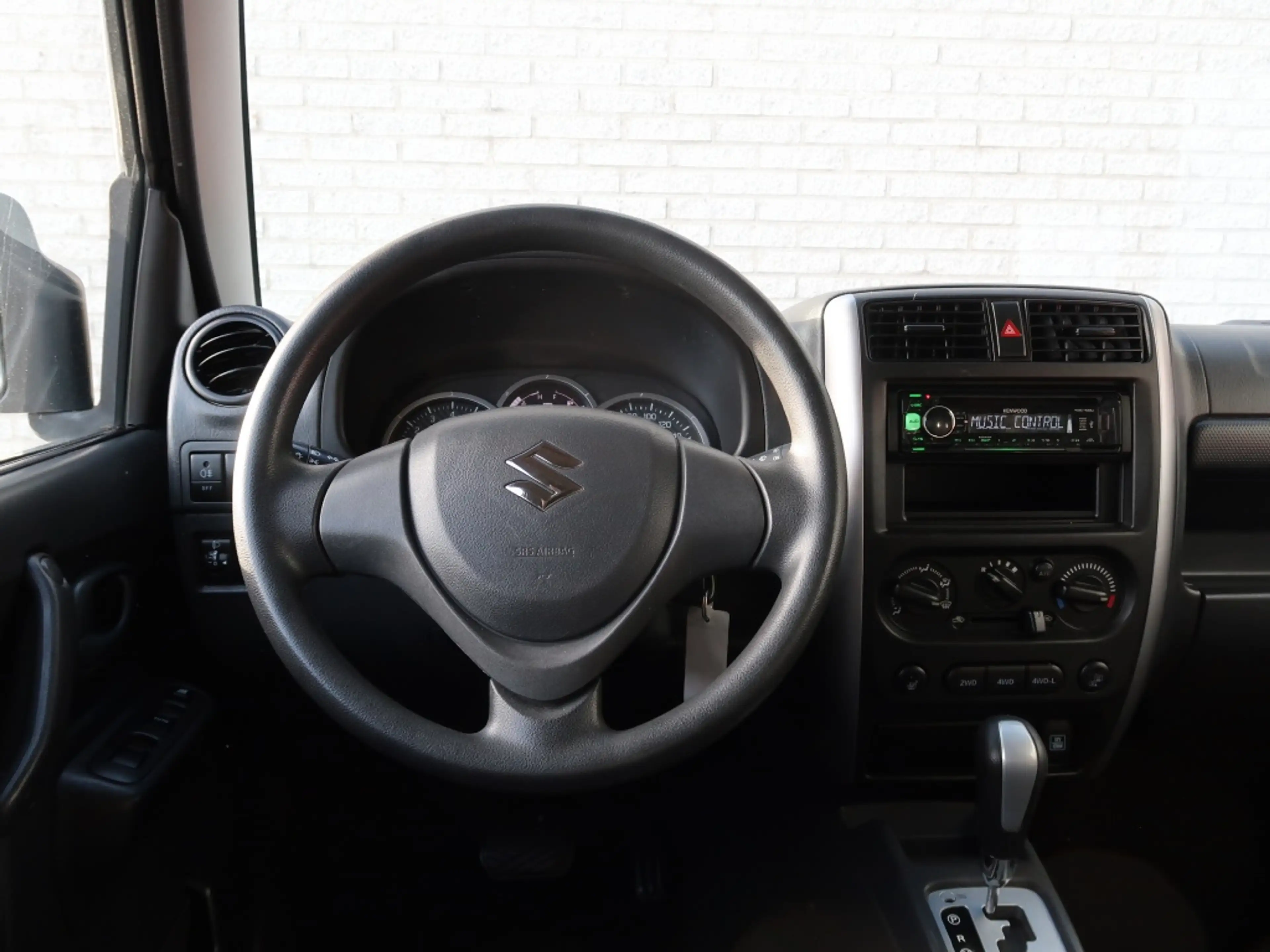 Suzuki Jimny 1.3 Exclusive / Automaat / 4x4 — photo 11