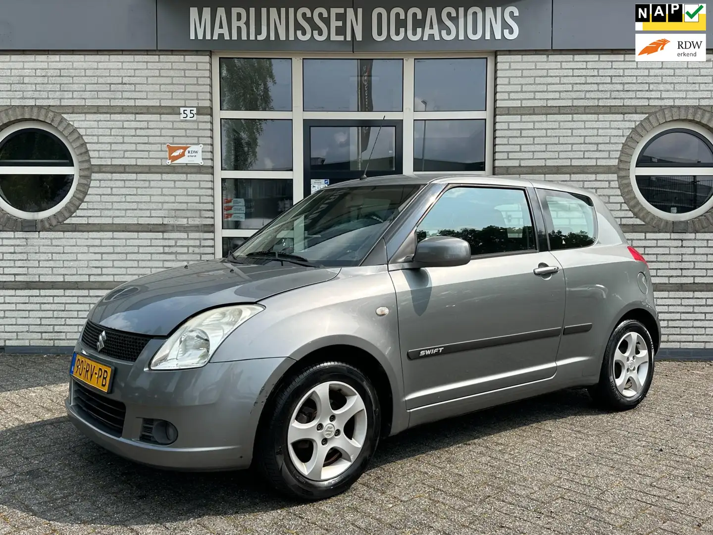 Suzuki Swift 1.3 Exclusive |Airco,ElekPakket| Grey - 1