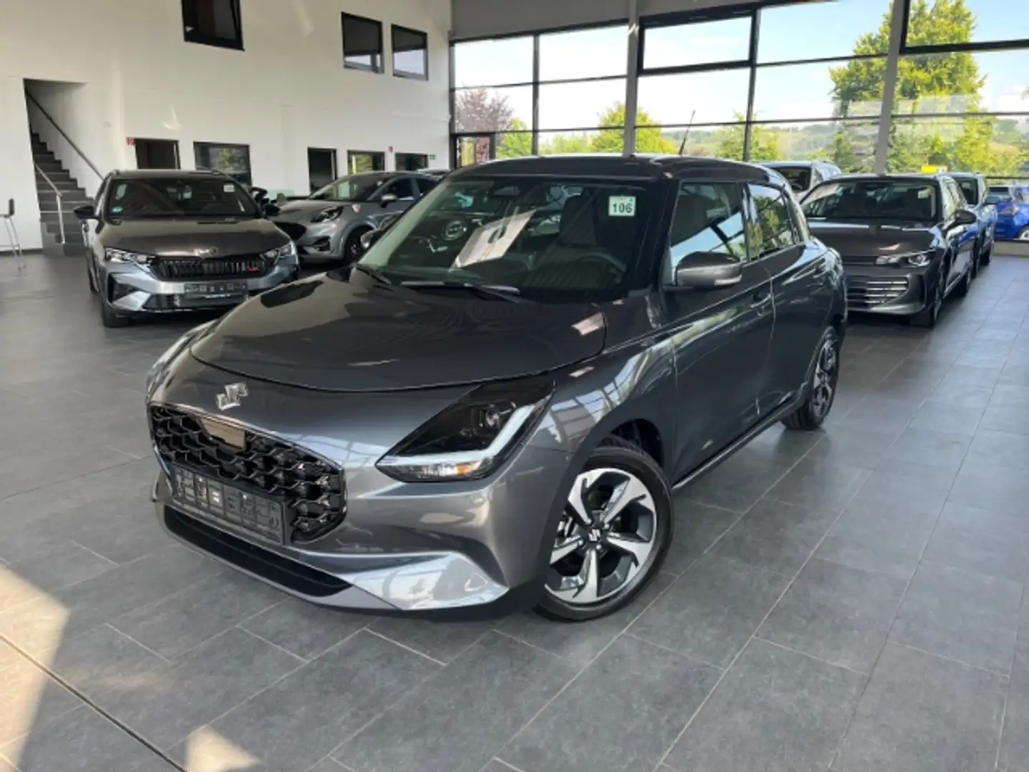 Suzuki Swift 1.2 Dualjet Comfort+ AHK ACC Navi LED Kamera Carpl Grigio - 1