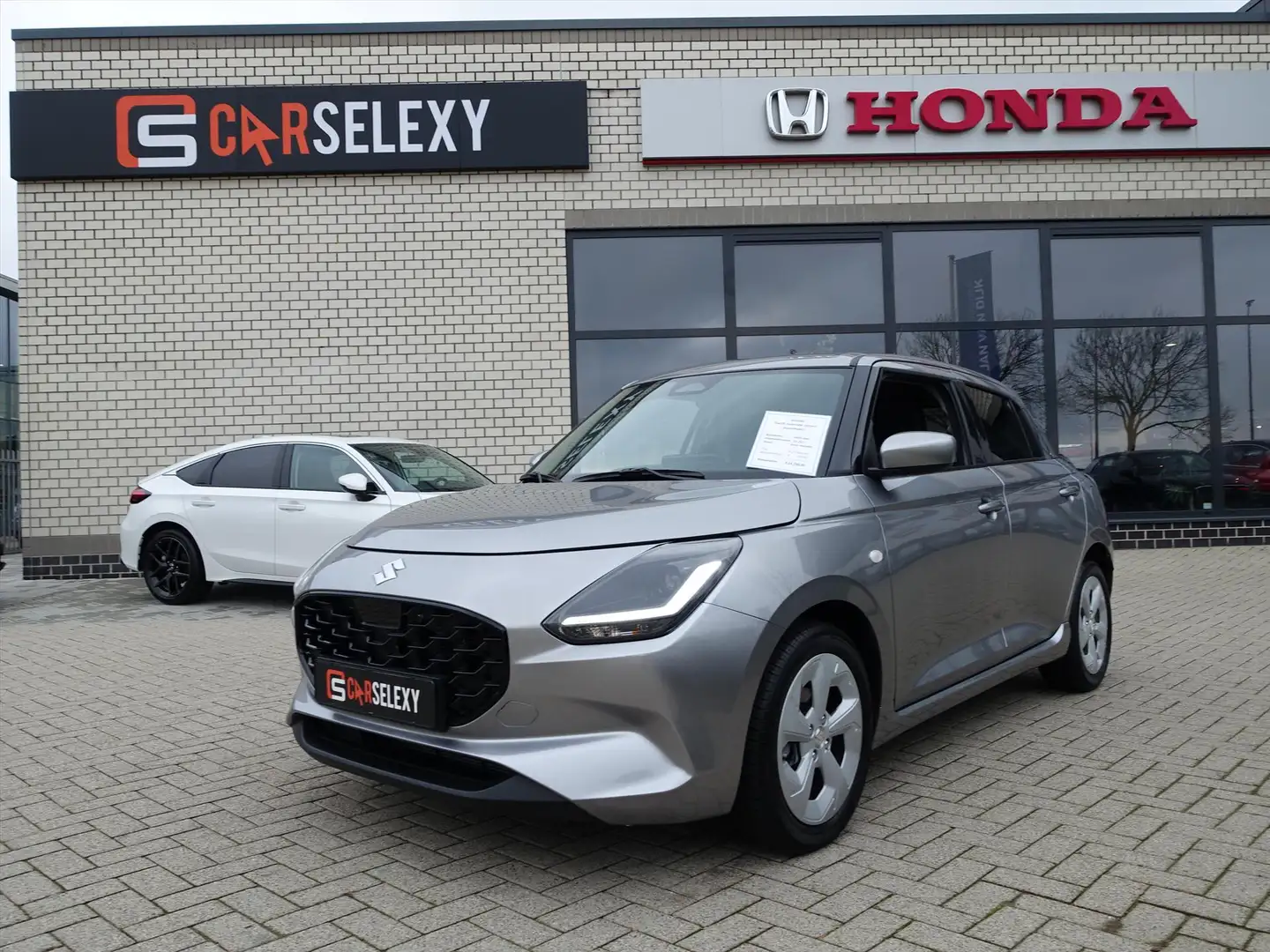 Suzuki Swift 1.2 Smart Hybrid 83pk CVT Select Gris - 1