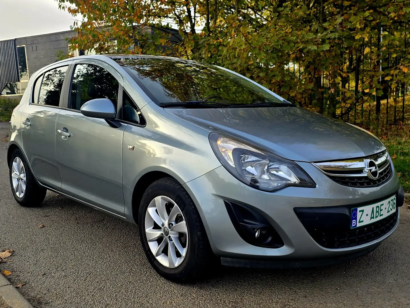 Opel Corsa 1.4i * Airco * Navi * Carnet * Garantie * Grijs - 1