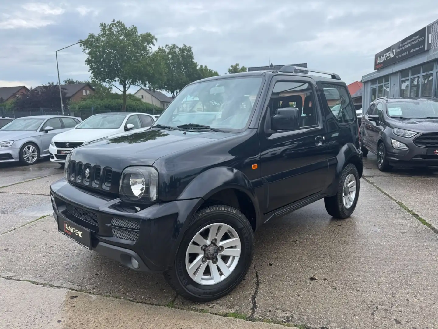 Suzuki Jimny 1.3 4WD Comfort*HU/AU Neu*Klima*Vollleder Noir - 1