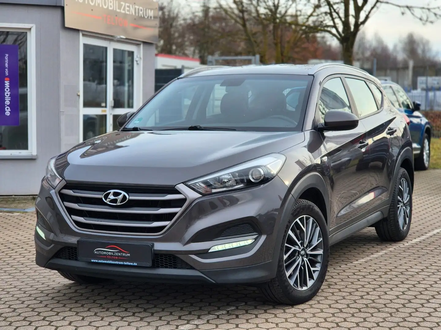 Hyundai TUCSON blue Classic 2WD Navi Tempomat Kamera SHZ Grau - 1