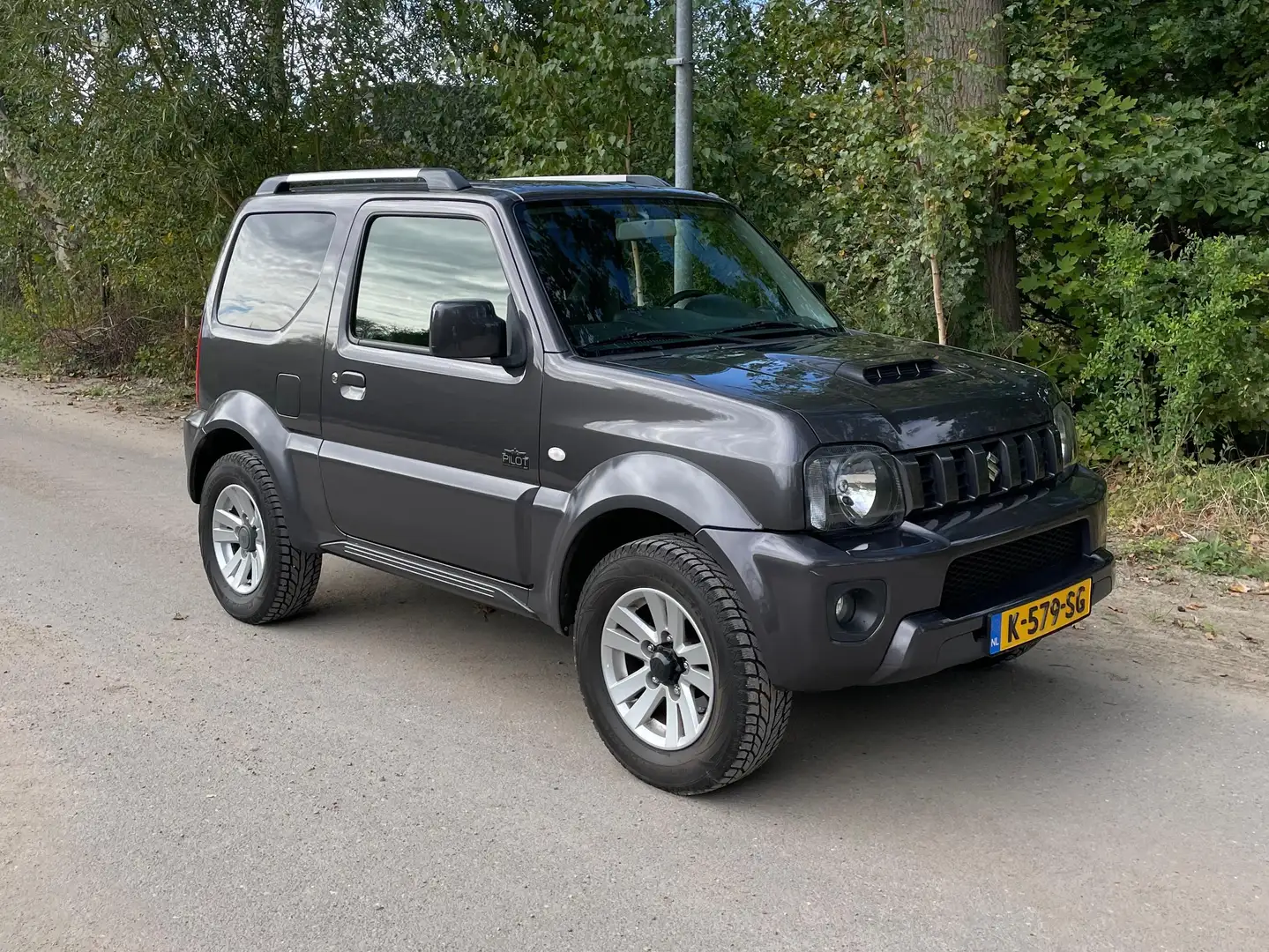 Suzuki Jimny Jimny 1.3 Exclusive Grijs - 1