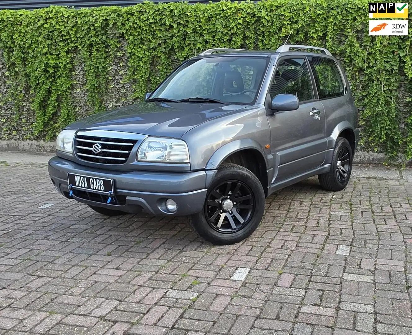 Suzuki Grand Vitara 1.6 Metal Top FreeStyle-3 Airco 4x4 Leer Wilde Bod Gri - 1